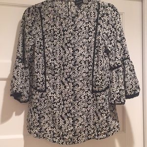 Black and white floral blouse with bell sleeves